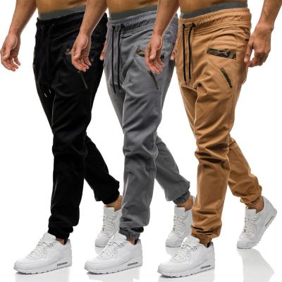 China Breathable Men's Strappy Casual Pants Skinny Pants Fashion Pockets With Camouflage Striped Pencil Pants Jogger Pants for sale