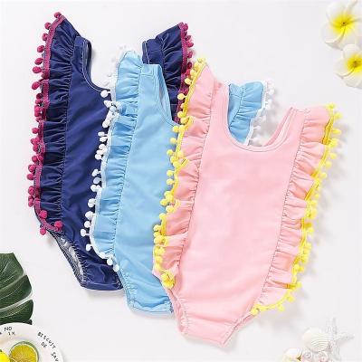 China 2022 New Children Girls Swimsuit Tassel Backless One Piece Ruffle Poms Breathable Cute Kids Beach Swimwear for sale