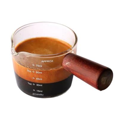 China Viable New Listing Clear Sublimation Glass Enamel Mug Espresso Coffee Measuring Cup With Wood Handle for sale