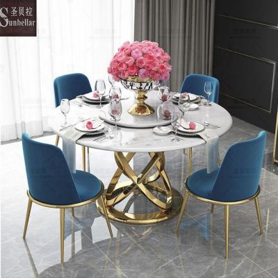 China Modern Italian luxury stainless steel round frame table with center stone revolving white marble top dining table with leather chairs for sale