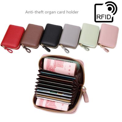 China New Style Men RFID Blocking Large Capacity PU Leather Small Purse Women Wallet With Card Holder &Wrist Strap for sale