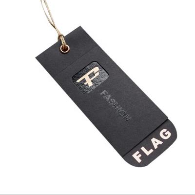 China Durable Black Swing Tags Garment Jeans Paper Hang Tag Designs With UV Gold Foil for sale