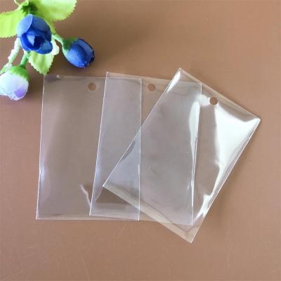 China Recyclable Wholesale Garment Accessory Transparent Opp Plastic Bag For Clothing Hang Tags for sale