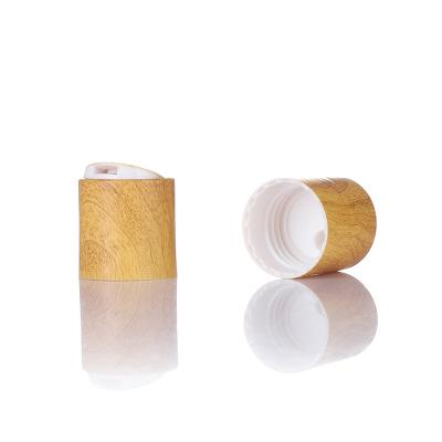 China Non Spill Good Quality Eco Friendly Wooden Disc Top Cap For Cosmetic Bottles for sale