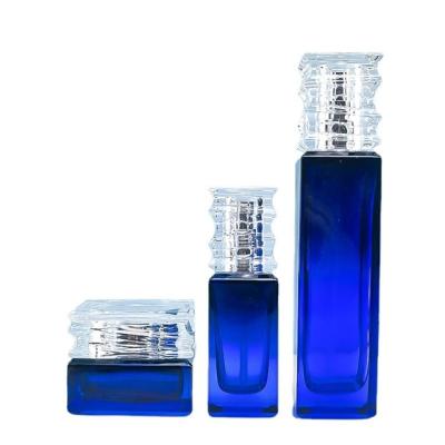 China Luxury Cosmetic Containers Custom Empty Face Glass Lotion Containers With Lotion Pump And Cosmetic Glass Jar for sale