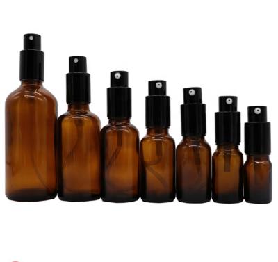 China Natural Amber Cosmetic Moisturizer Glass Bottle Personal Care Toner Cream Skin Care Make Up Use With Metal Black High Quality Pump for sale