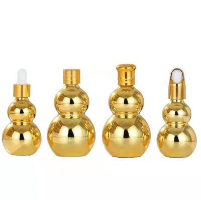 China Personal Care 15ml 30ml Double Shape Luxury Null Gold Plate Essential Oil Dropper Serum Glass Bottle Personal Face Care With Metal Cap for sale