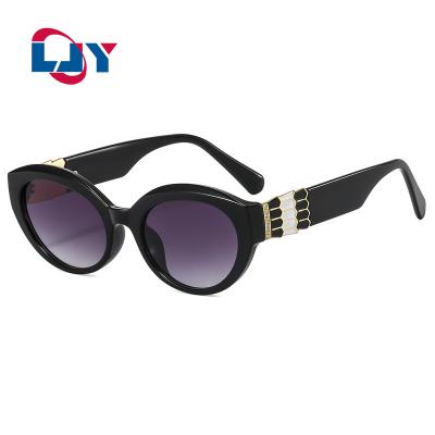 China High Quality Street Fashion Glasses 2220 2022 Cat Eye Sunglasses Small Metal Frame Leopard Print Unisex Sunglasses for sale