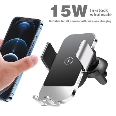 China Led lights with logo 15W wireless charging gravity phone auto positioning bracket for car for sale