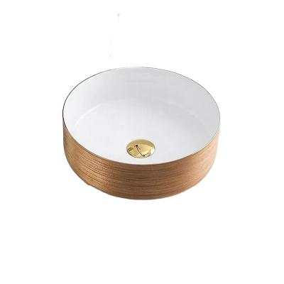 China 2022 New Rose Gold Small Round Ceramic Wash Basin Bathroom Sink Easy Clean White Faucet for sale