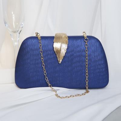 China Shiny Luxury PU Clutch Bag Evening Clutch Bag Brand Metal Leaf Design Chain Party Women Handbags 2022 for sale