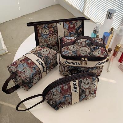 China Travel Cute Large Capacity Portable Makeup Toiletry Bag Fashion Pattern Bear Cartoon Style Cosmetic Bag for sale