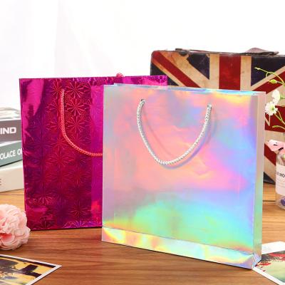 China Recycled Materials Rainbow Colored Christmas Gift Paper Laser Holographic Bag For Women Cosmetic Jewelry Gift Packages for sale