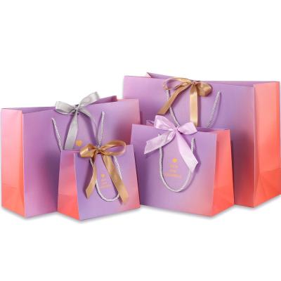 China Custom Printing Ribbons Wigs Luxury Shopping Paper Bags Recyclable With Brand Logo for sale