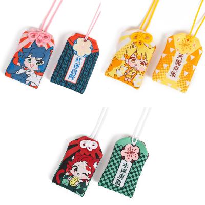 China Cute Eco-friendly Demon Slayer Anime Cartoon Key Chain Omamori Agatsuma Zenitsu Kamado Tanjirou Canvas Embroidery Lucky Bag Jewelry for sale