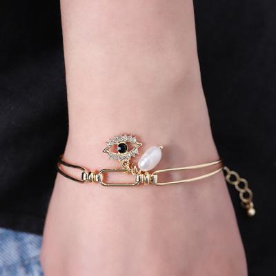 China 2022 Vintage Hot Selling Zircon Evil Eye Bangle Bracelet 18K Gold Pearl Freshwater Blue Eyes Shiny Adjustable Bracelet for sale