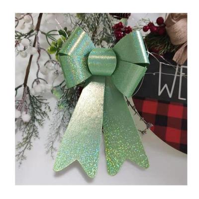 China Hot Sale Christmas Decoration HC121207 Shinny Glitter Laser Ribbon PVC Bows Decorative Christmas Tree Topper Bow for sale