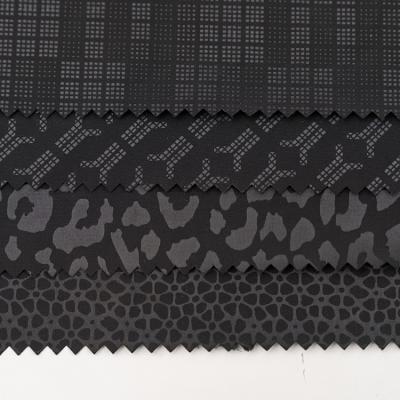 China Breathable Recycled Memory Emboss Fabric Solid Woven Patched Dyed Waterproof 100% Polyester For Clothing for sale