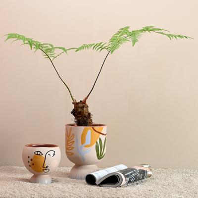 China Garden Cup Shape Ceramic Plant Pots Modern Unique Style Indoor Cactus Abstract Decor for sale