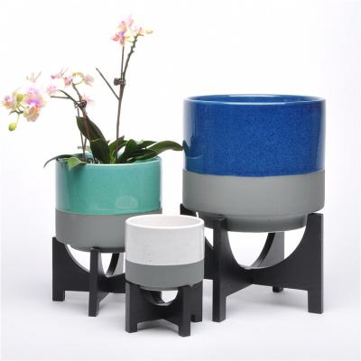 China Eco-friendly reactive luster graceful planter succulent pots/garden indoor outdoor home ceramic pot with wooden stand for sale