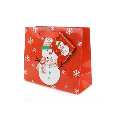 China Handmade Wholesale Custom Logo Snowman Christmas Shopping Gift Paper Bags Red Carrier Bag For Kids for sale