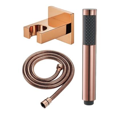 China Stylish Round Rose Gold Copper Hand-Held Shower Head With Hose for Modern Bathrooms for sale