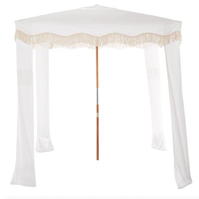 China Custom made luxury vintage style beach tent sun shelter popular outdoor beach hut sun shelter antique white waterproof boho with tassels for sale