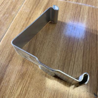 China Stainless Steel SUREALONG Sheet Metal Fabrication Industry Custom Stamping Steel Spring Clips for sale