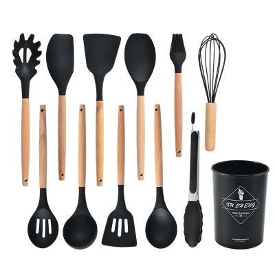 China Sustainable Food Grade Black Silicone Shovel Custom Premium Kitchenware Cooking Set With Wooden Handle for sale