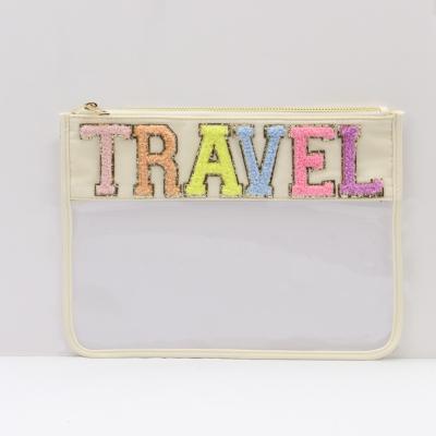 China Fashion Transparent PVC Cosmetic Bag Clutch Women Clear Travel Make up Cosmetic Bag  New letters on pouch for sale