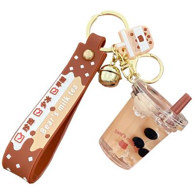 China Fashional Souvenir Gifts Sample Tea Creative Pendant Acrylic Bottle Free Cute Oil Lollipop Quicksand Key Chain Bag Floating Key Chain for sale