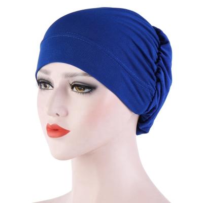 China Fashion Turban Hat Wrap Headscarf Turban Cap High Quality Muslim Solid Soft Cross Head Women Stretchy Turban Hat for sale