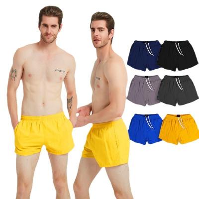 China Anti-wrinkle beach shorts men's solid color quick-drying swim trunks wholesale custom made breathable swimming trunks for sale