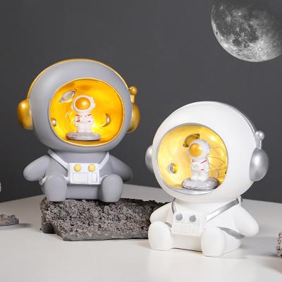 China 2022 Modern New Cute Led Coin Piggy Bank Astronaut Ornaments Treasure Coin Storage Box Cartoon Astronaut Piggy Bank For Children Gift for sale