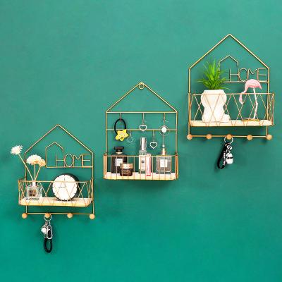 China Modern Creative Nordic Gold Shape Storage Rack Multifunctional Bedroom Wall Decoration Rack With Hook for sale