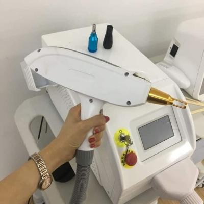 China Mini 2022 ND yag laser eyebrow tattoo removal carbon pigment peeling / tattoo removal laser pigments facial removal 1064nm 532nm 1320nm for sale