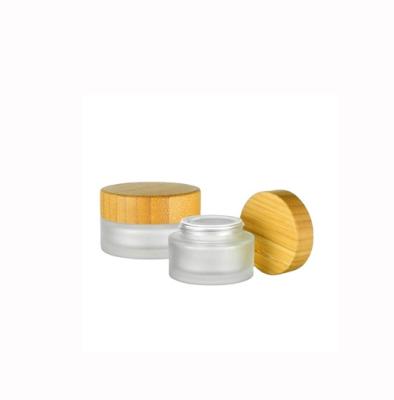 China High Quality Non Refillable Matte Glass Bottle Bamboo Lid Cream Jar With Nature Bamboo Cap for sale