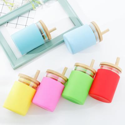 China Amazon Success Bamboo Lid Kids Viable Water Bottle Glass Straw Tumbler With Silicone Sleeve for sale