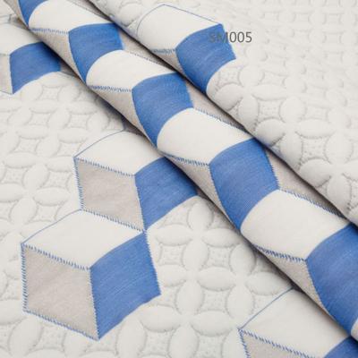 China Sustainable Home Textile Knitted Jacquard Fabric For Mattress Polyester Material Fashion Flower And Cube Design for sale