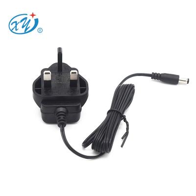 China UK Wall Plug In AC 230v 50hz Input Wall Mount UK Plug In AC DC Adapter 5v 9v 24v 12v 0.5a 1a 12 Volt Adapter 500ma Power Adapter For Led Lights for sale