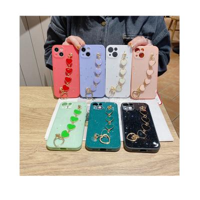 China Luxury Shockproof Wooden Epoxy Resin Lens PC Chain Strap Phone Case With Hand Chain For Apple for sale