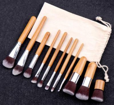 China Angular Blush Bamboo Cosmetic Brush 11pcs Set Brush With Natural Jute Bag for sale