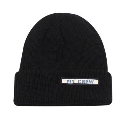 China COMMON 100% Acrylic Custom Knit Cool Skull Cuff Skullcap With Embroidery Patch Knitted Hat for sale