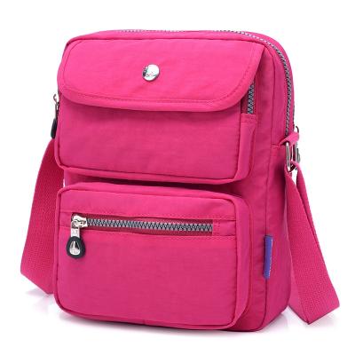 China Jinqiaoer Wrinkle Water Proof Girls Ladies Leisure Cross Shoulder Waterproof Nylon Handbags Long Strip Bags for sale