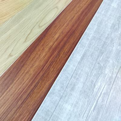 China Wooden grain easy installation Luxury vinyl tile SPC flooring with IXPE EVA under layer for sale