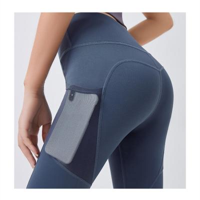 China Hot Sale Breathable Women Workout Running Yoga Leggings Stretch High Waist Yoga Pants With Mesh Pockets for sale