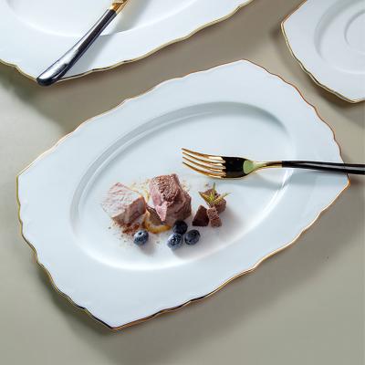 China Design YAYU Fashion Ceramic Dinner Dish Porcelain Shape Dessert Dish Viable Modern Rectangular White Irregular Rim Gold Color Ceramic Dinner Dish for sale