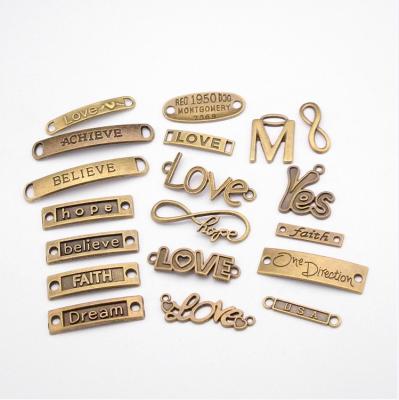 China Low casual/sporty wholesale custom metal word logo charms antique bronze plated pendants for diy necklace jewelry making for sale