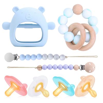 China Non-Toxic Hot Sale Food Grade Handle Silicone Ring Teething Toys Funny Durable Non-Toxic Wooden Baby Teether Toy for sale