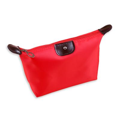 China Fashion Candy Colored Dumpling Shaped Foldable Cosmetic Bag Waterproof Makeup Wash Bag for sale